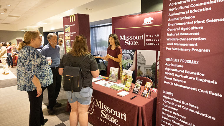 Missouri State representative speaking with a prospective student